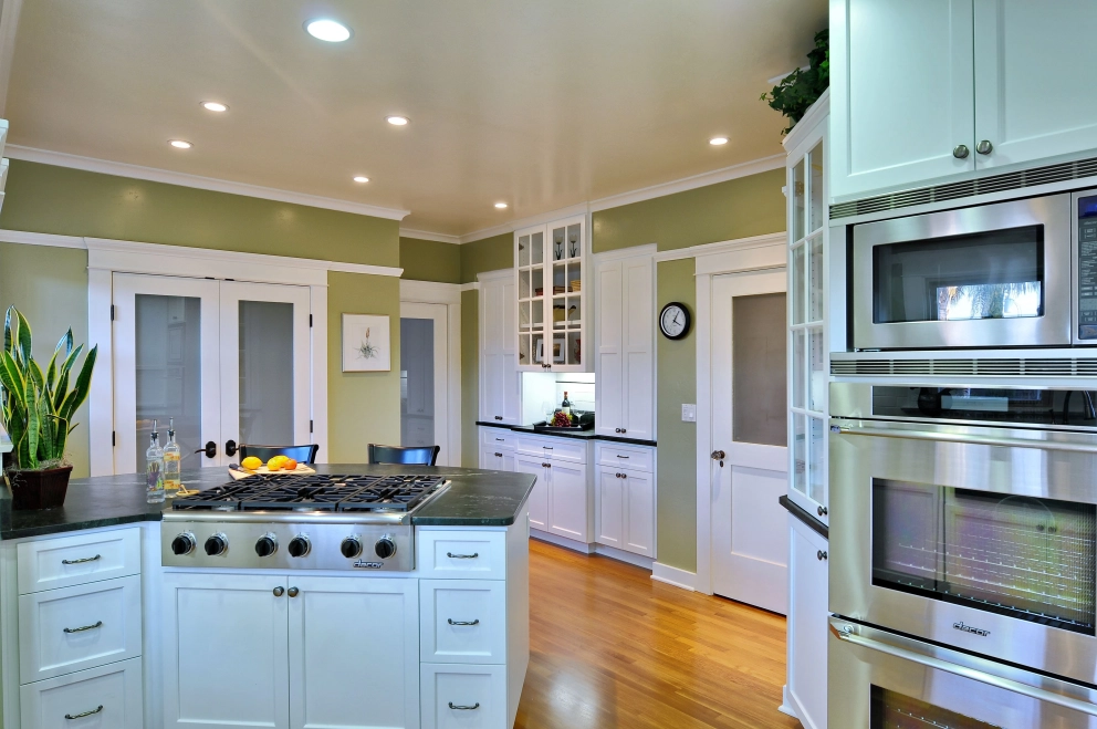 White shaker cabinets with black countertops