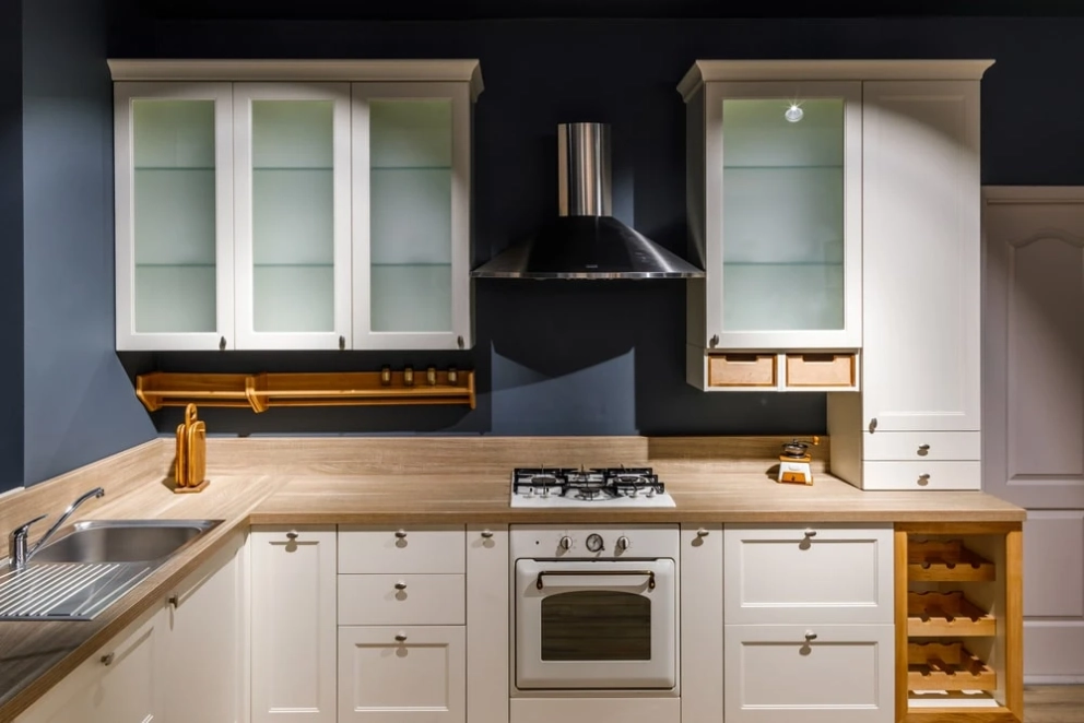 white painted plywood cabinets with exposed plywood countertop