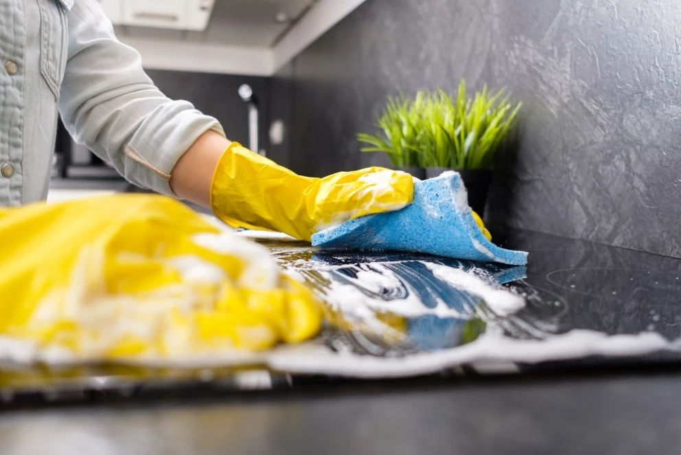 cleaning countertop with a baking soda