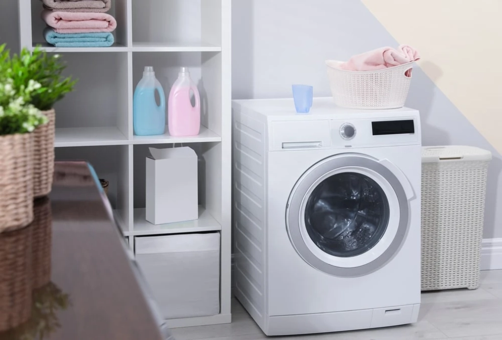 laundry room with white open shelf cabinets
