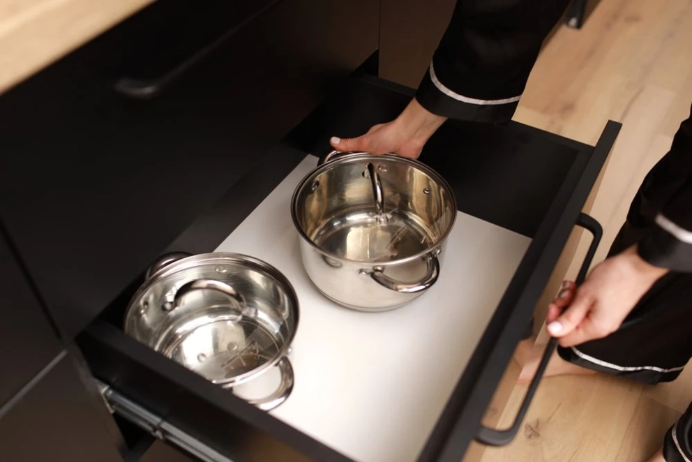 deep drawers with paper liner and cooking pans