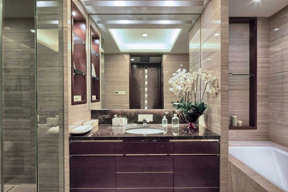 built-in vanity with matching recessed shelves in the bathroom