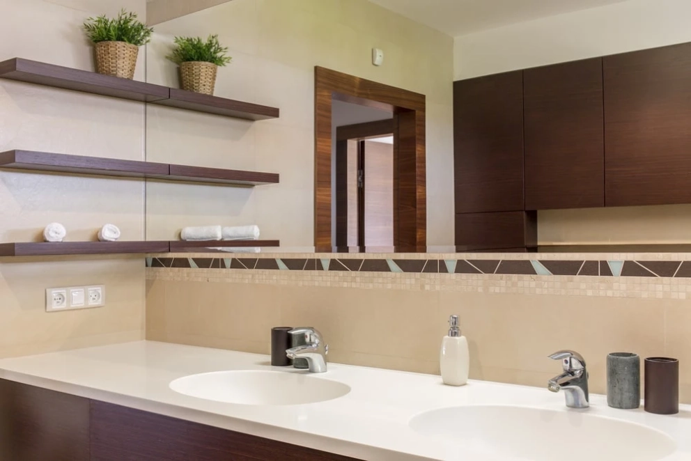 wood fitted cabinets and shelves in the bathroom