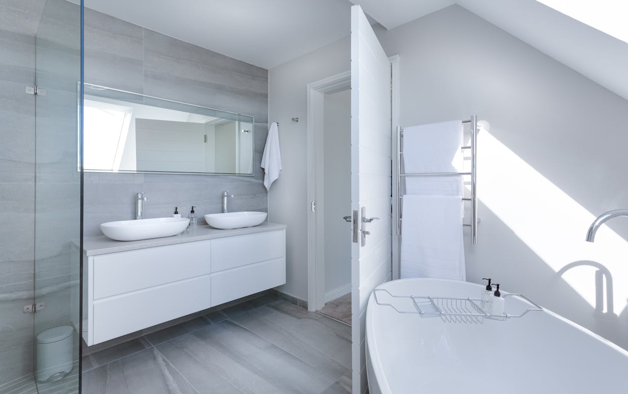 modern bathroom with efficient layout - vanity, shower and toilet placement