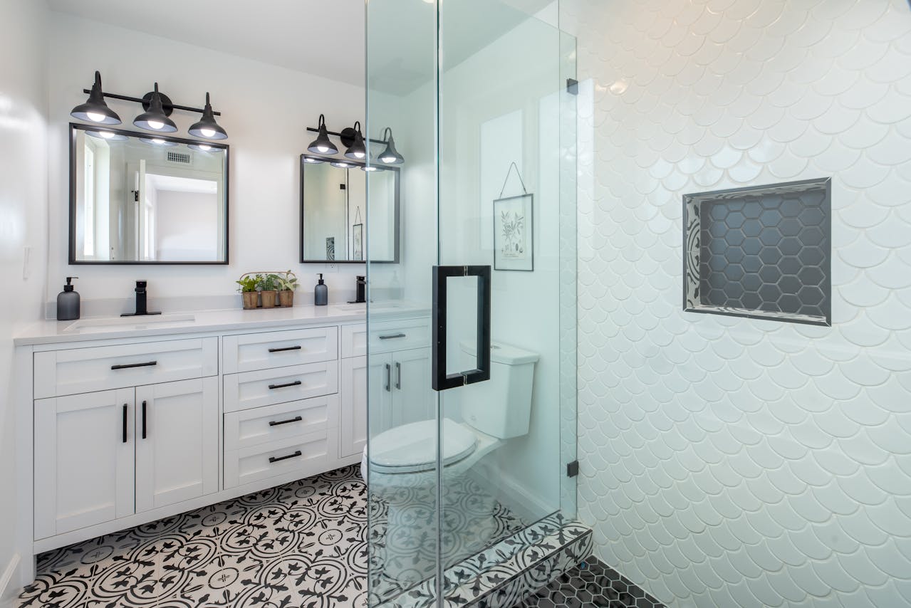 bathroom with clear wet and dry separation, walk-in shower with glass divider toilet, and vanity