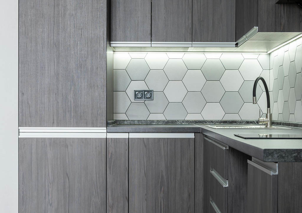 refaced laminate kitchen cabinets and honey comb backsplash