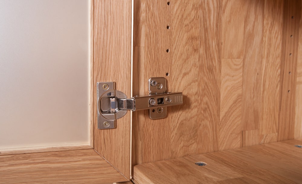 Conceal soft close cabinet hinges at the veneer door