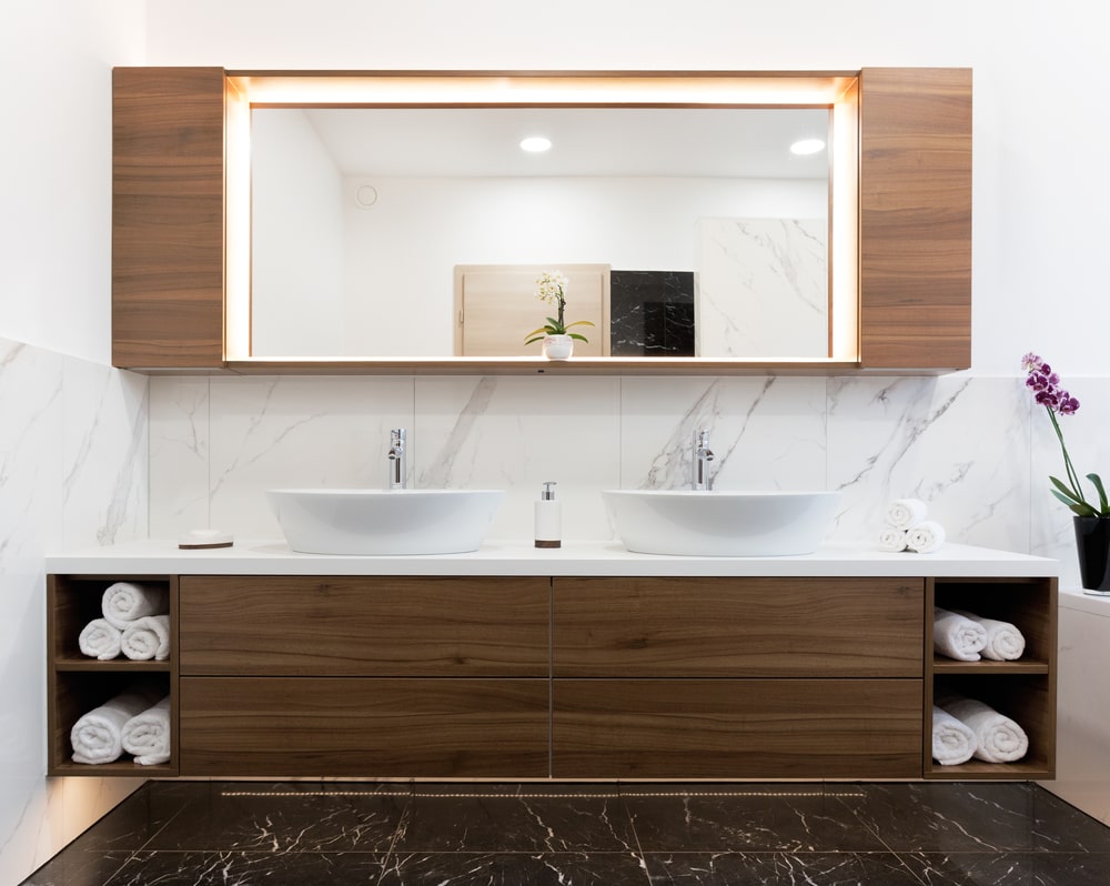 Walnut vanity with shelves and mirror in the bathroom
