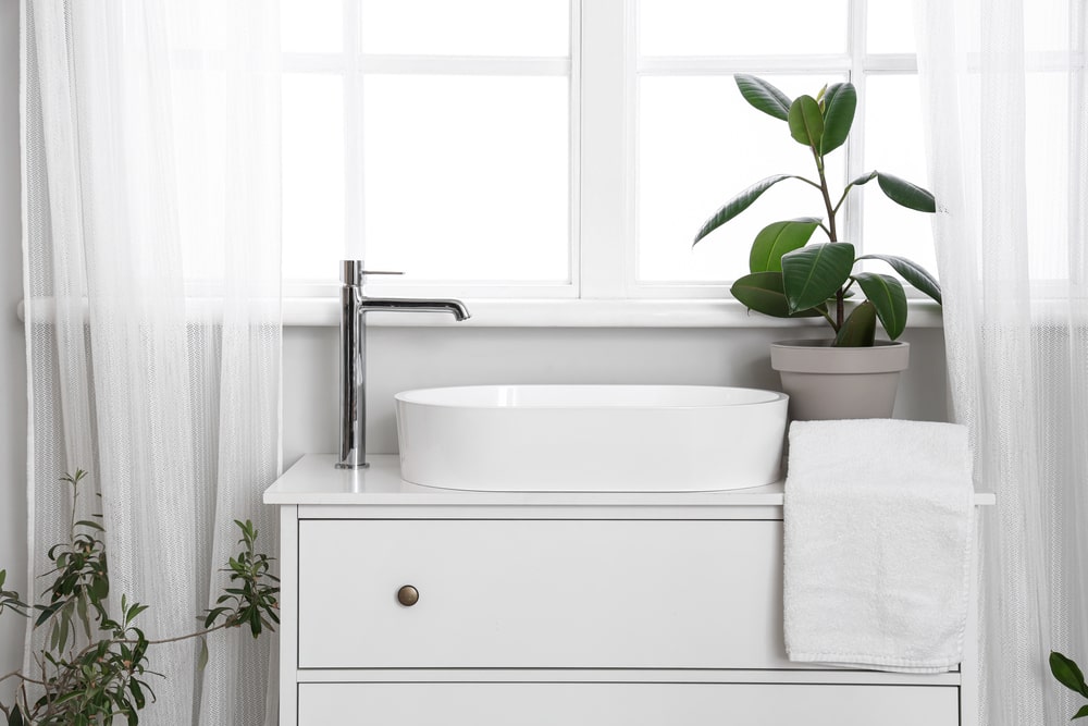 shallow white bathroom vanity with basin sink