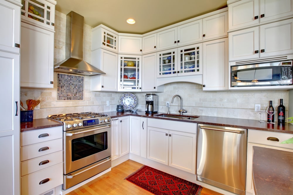 white shaker cabinets with over the stove valance arch