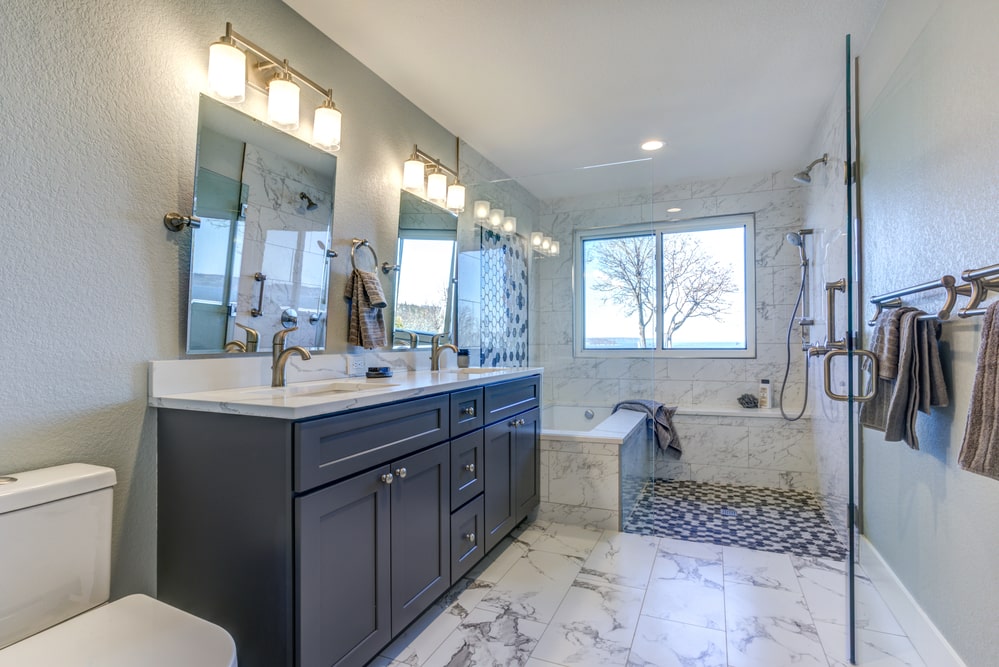 white-tone bathroom with marble-look vinyl flooring