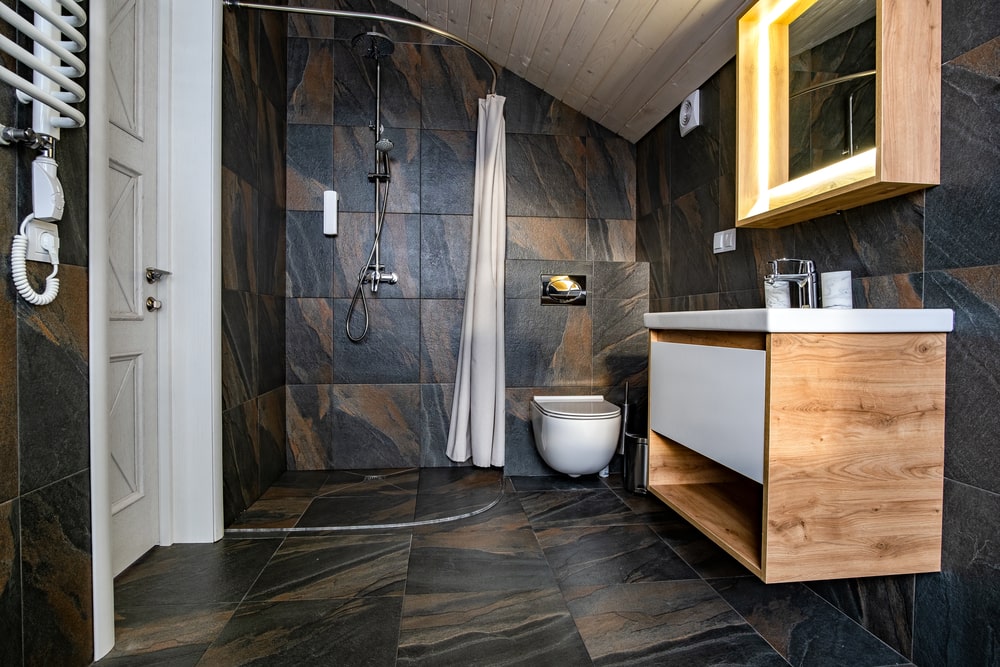 small bathroom layout design in dark hues