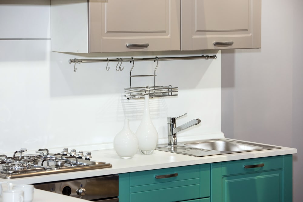 two-tone kitchen cabinets teal and beige