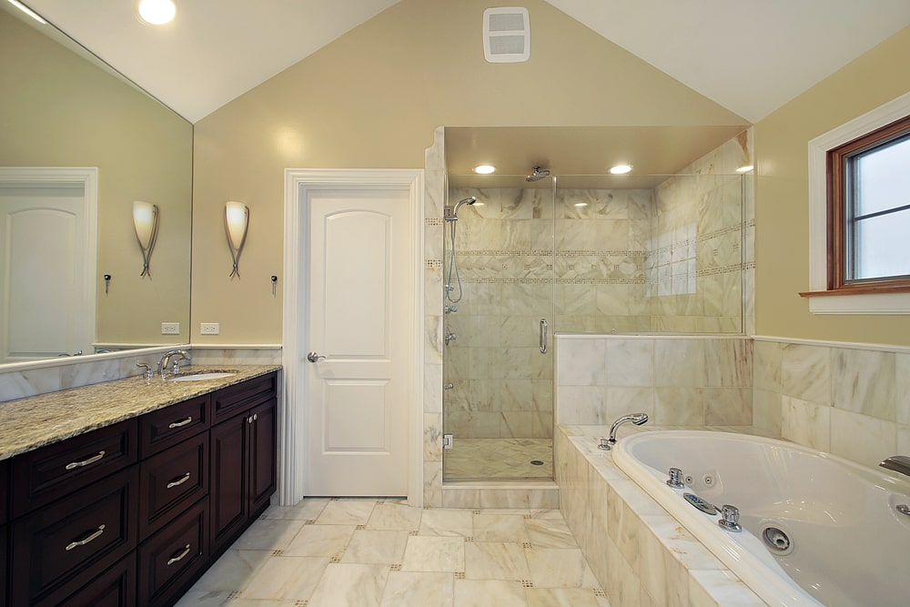 built-in bathroom vanity cabinet with marble countertop