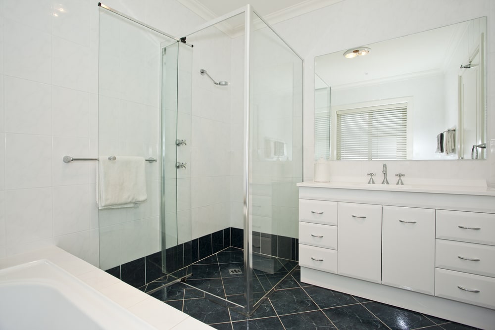 premade bathroom vanity  in the white toned bathroom with black floor