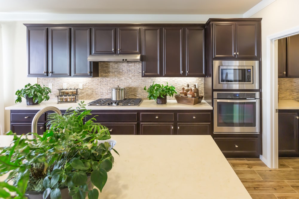 bright spacious transitional kitchen with dark cabinets