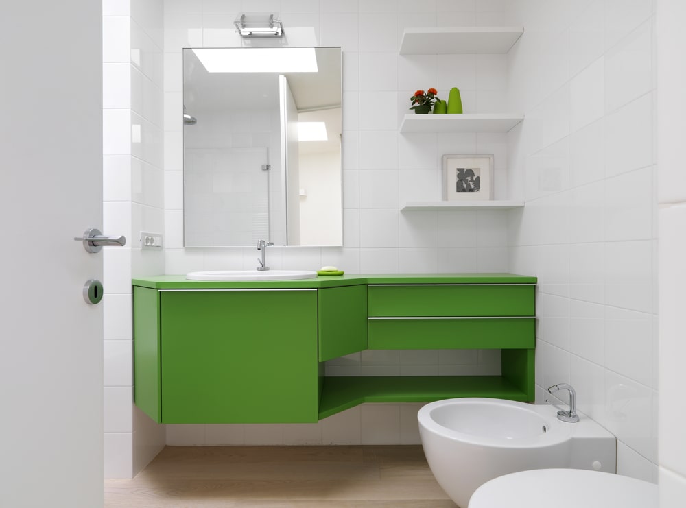 custom-made green vanity with nickel pull hardware