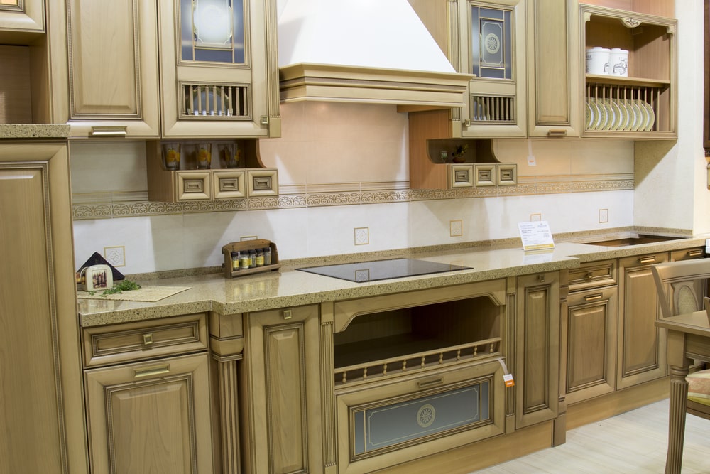 fluted columns and beaded doors on the wooden kitchen cabinets