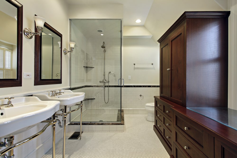 intricated design of the bathroom with custom wood storage cabinets