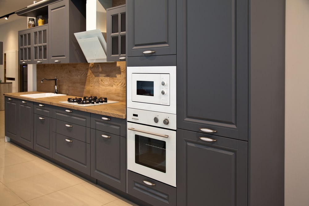 kitchen cabinets with built-in microwave and oven