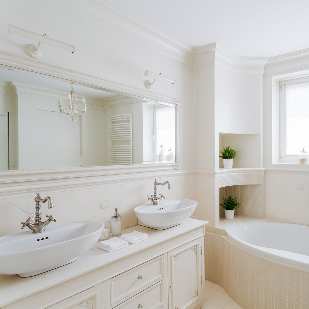 white bathroom with vintage taps and vintage bathroom vanity