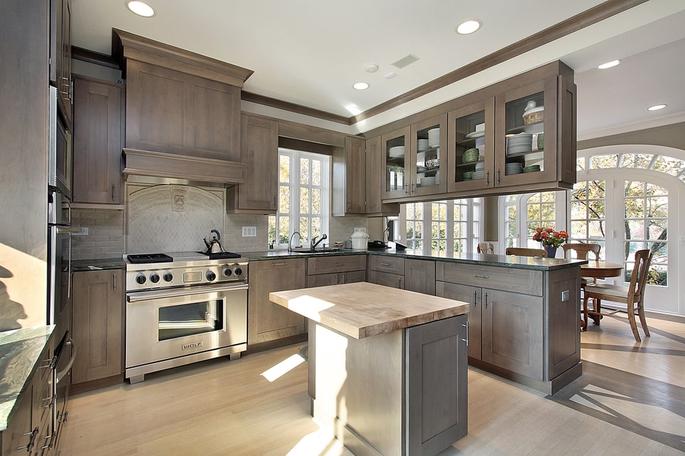 wood built-in cabinets with above-the-stove and window valances