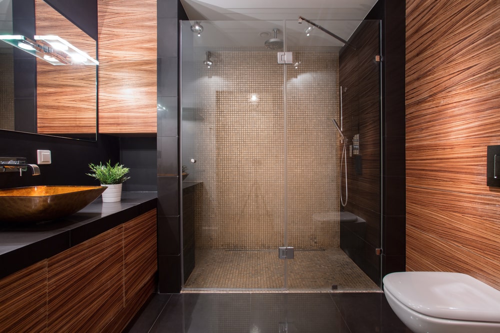 Black industrial interior with glass shower enclosure