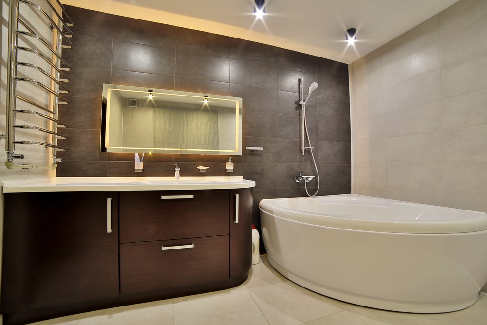 dark brown bathroom cabinet and big bathtub