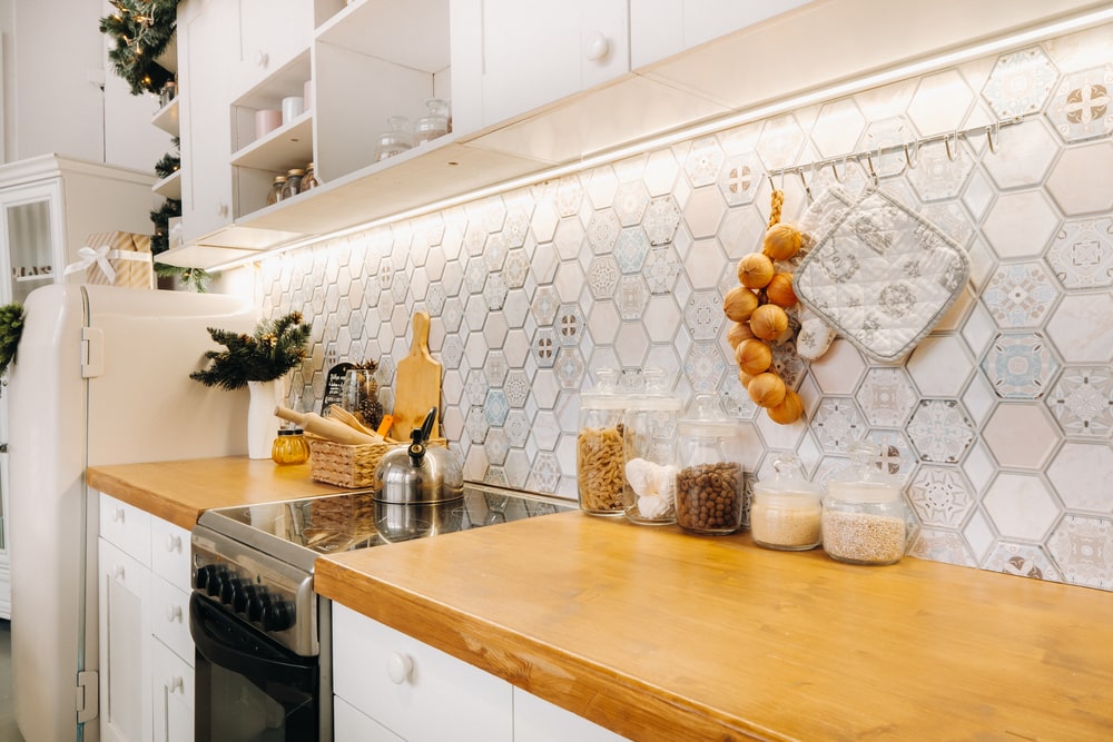 honeycomb backsplash in transitional white kitchen