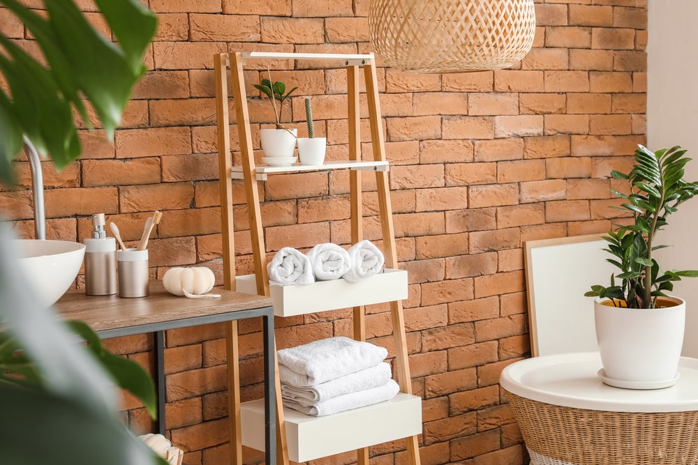 spa accessories on the wooden bathroom rack