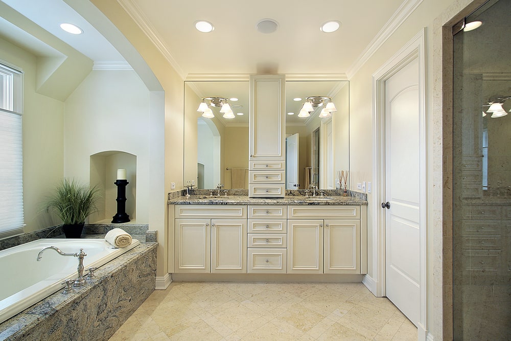 spacy bathroom with beaded vanity and tower cabinet