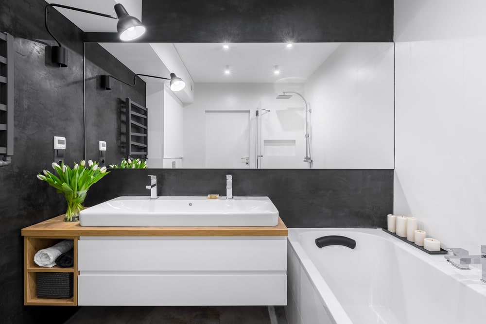wooden details in black and white bathroom