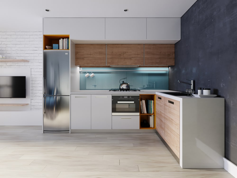 minimal kitchen with recipe shelf above the fridge