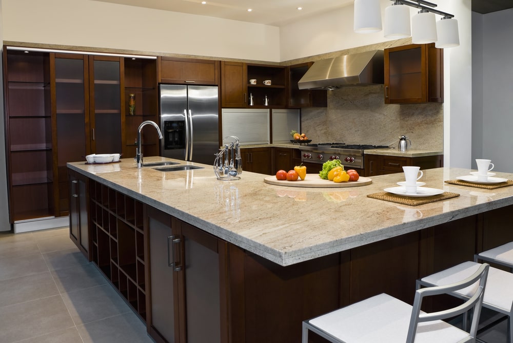 double-edge travertine countertop and island top in the kitchen