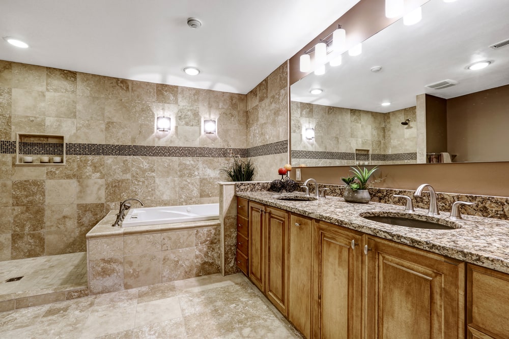 high end solid wood vanity and granite countertop in the luxury bathroom