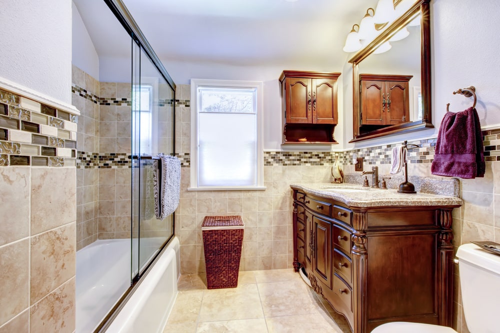 luxury styled bathroom with storage cabinets