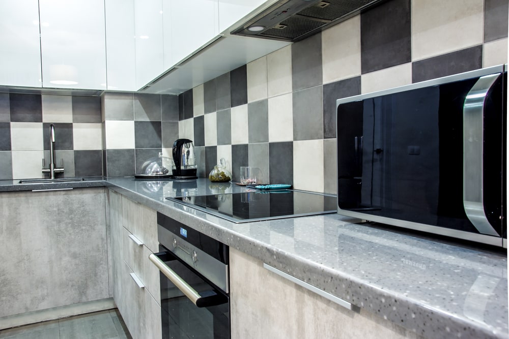 monochrome kitchen with cement veneer kitchen cabinets