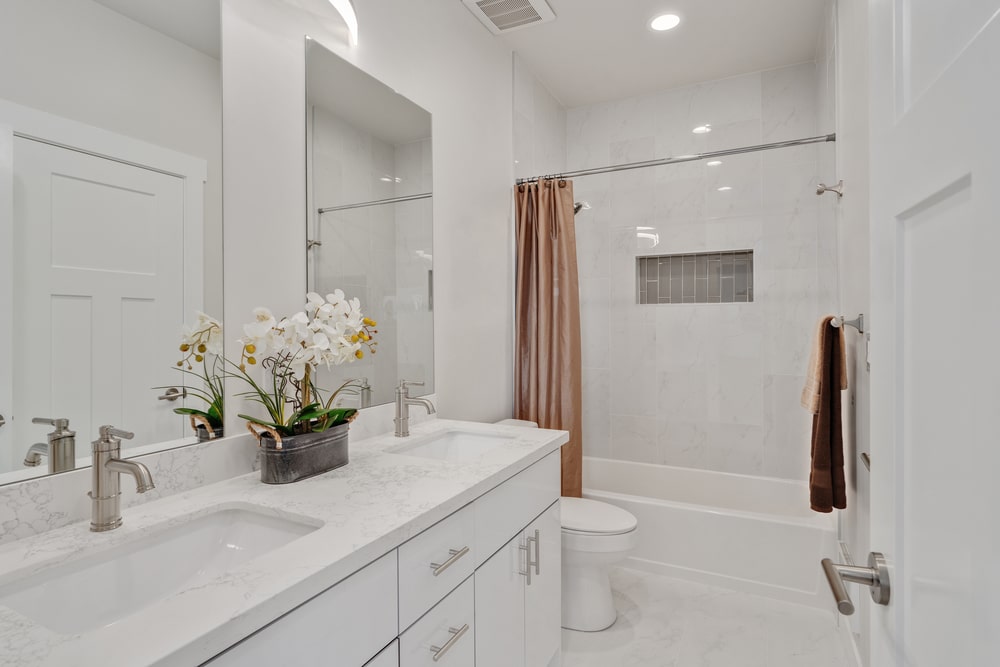 white colored bathroom with gloss vanity resurfaced