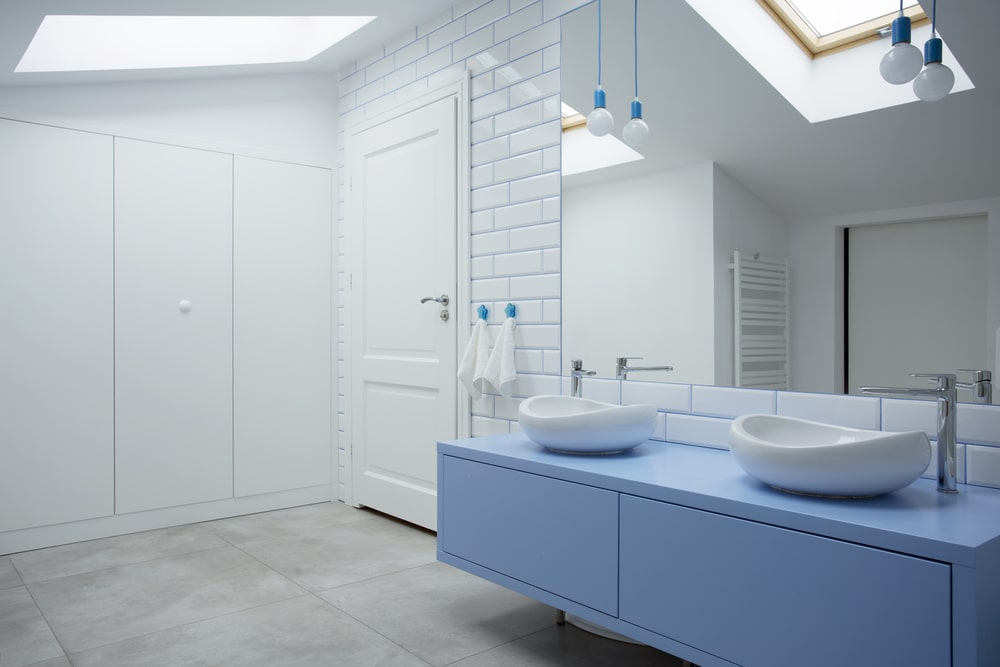flat-panel floating blue vanity cabinet in the white bathroom