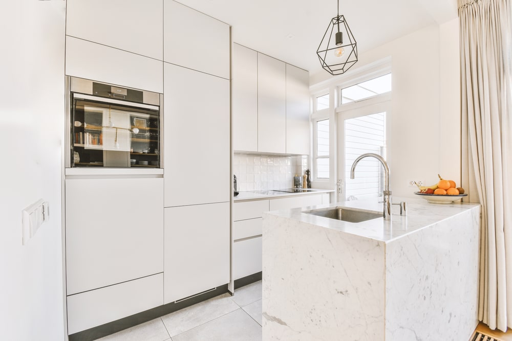 white marble waterfall island in the kitchen