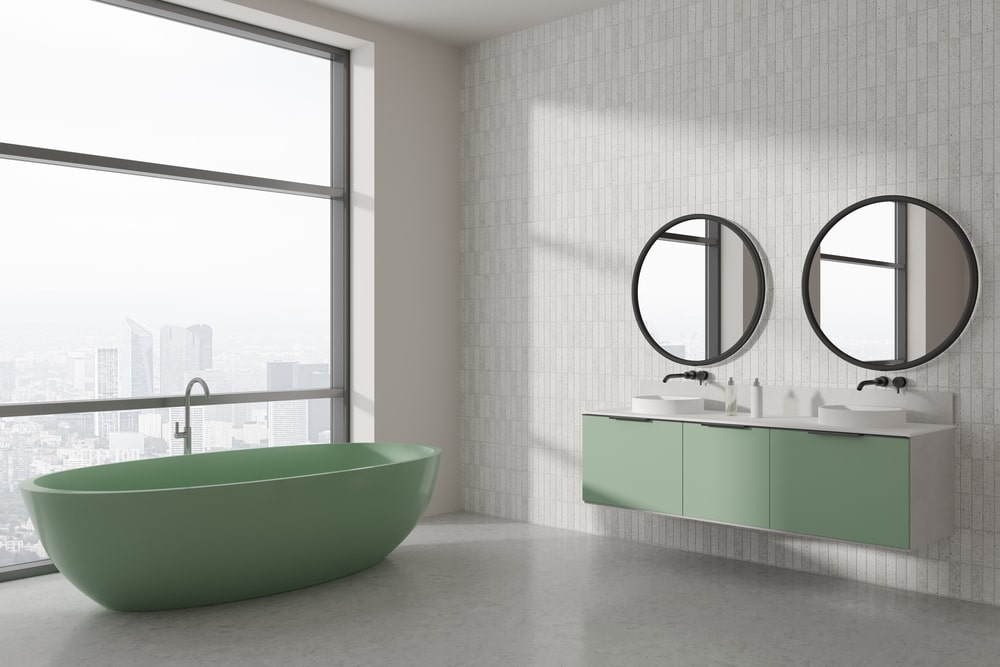 mint green vanity and bathtub in the bathroom with a large window