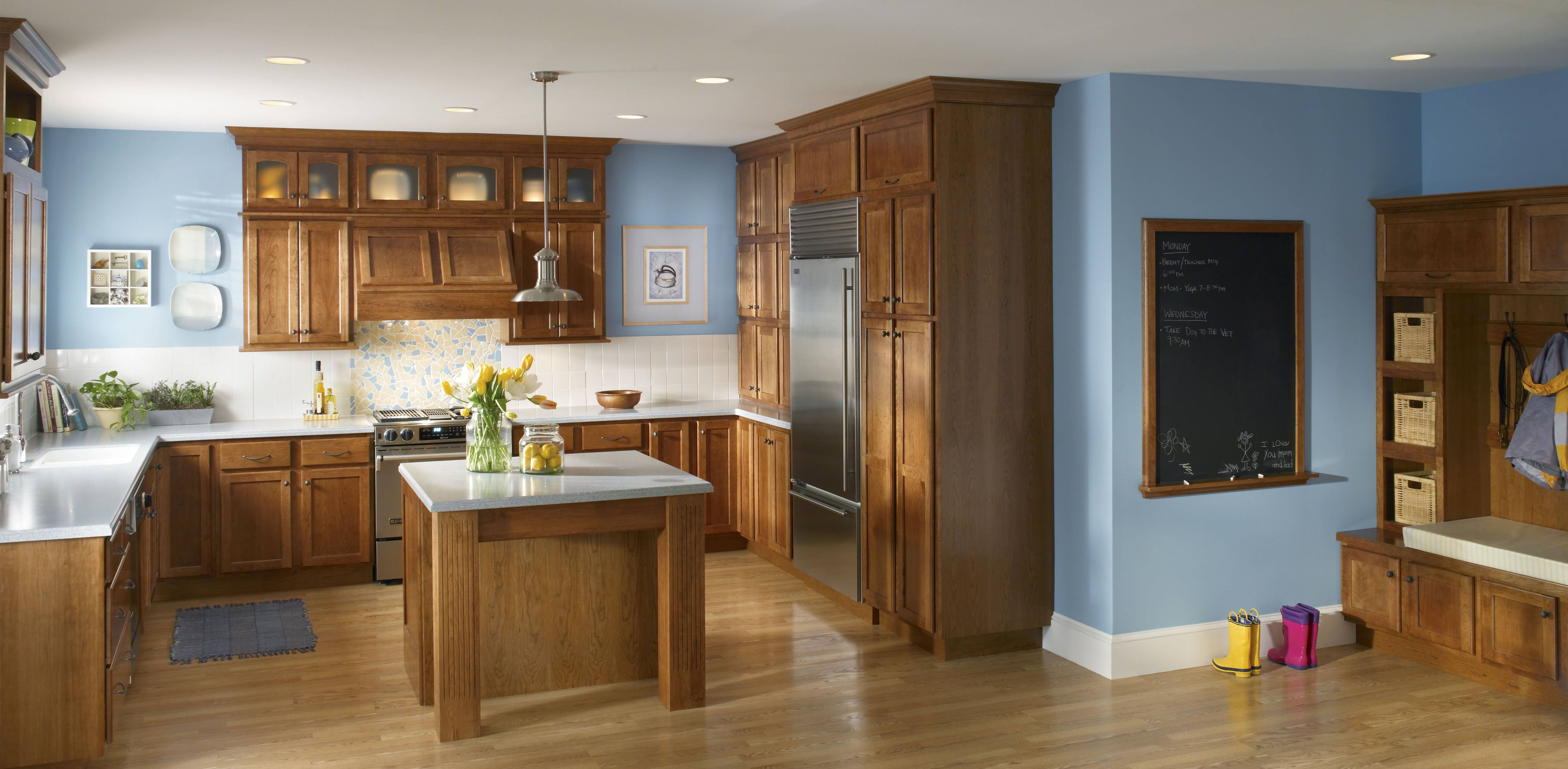 light blue wall kitchen brown cabinet