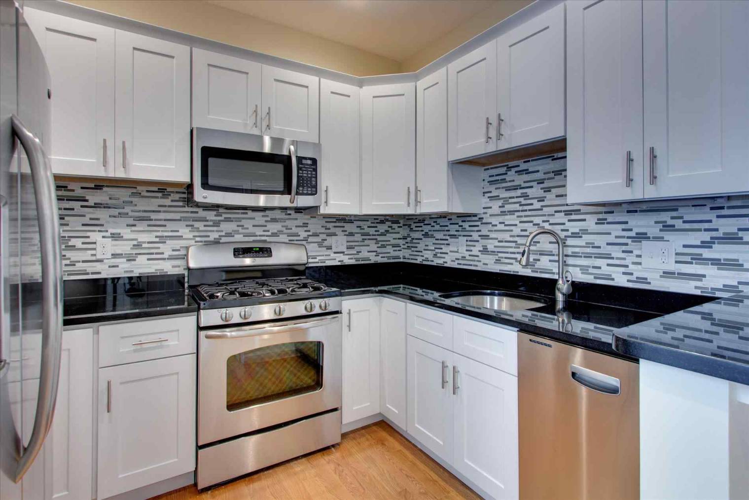 Backsplash ideas for white cabinets and black countertops
